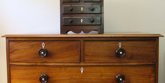 A Cape Teak, Pine, Yellowwood and Bone Inlaid Miniature Chest of Drawers, mid 19th c